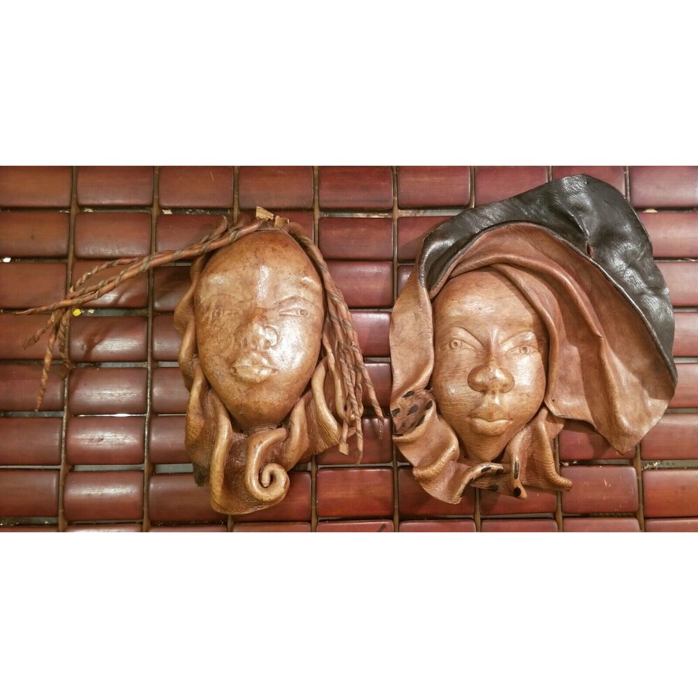 Pair Vintage African Handcrafted Leather Woman's Face Sculptures. 8.5"x7" 7"x4"